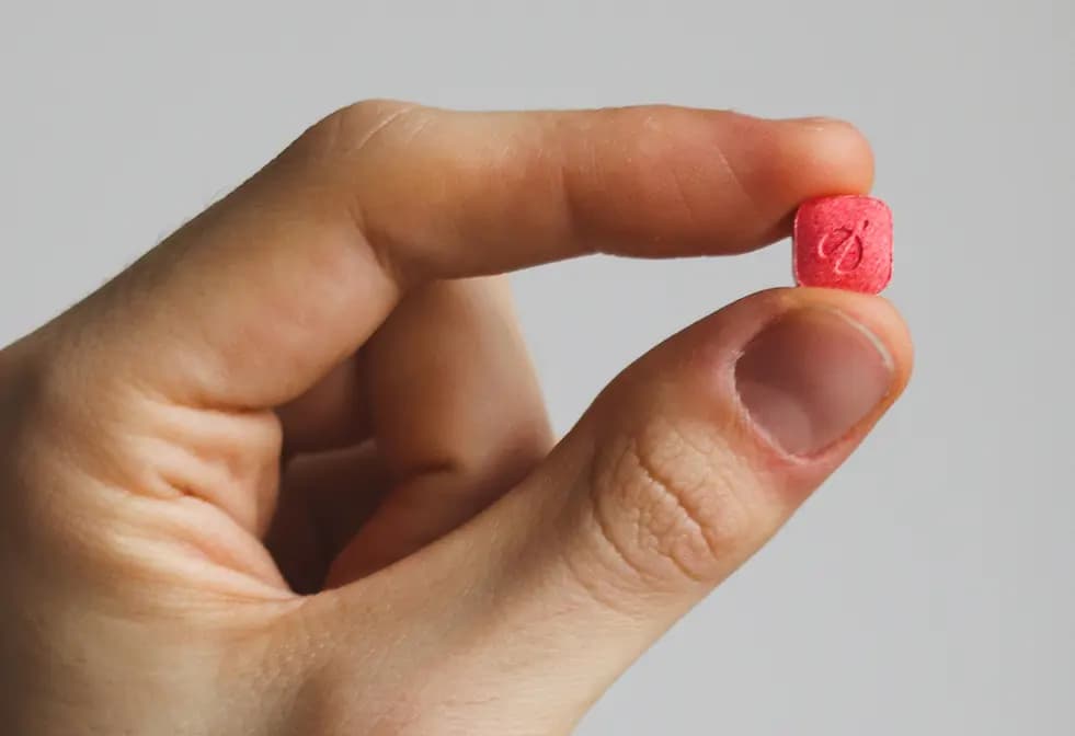 Person holding rocket tablet infront of envelope